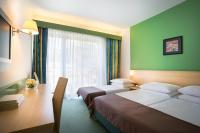 Ein Bett oder Betten in einem Zimmer der Unterkunft Remisens Hotel LUCIJA