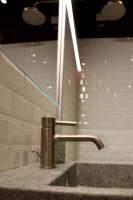 a sink with a faucet in a bathroom at OFFICINA TESINI Guest Rooms Verona in Verona