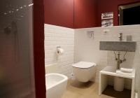 a bathroom with a toilet and a sink and a shower at OFFICINA TESINI Guest Rooms Verona in Verona
