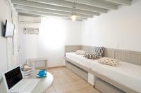 Postel nebo postele na pokoji v ubytování Gryparis' Club Apartments
