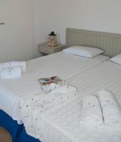 Postel nebo postele na pokoji v ubytování Gryparis' Club Apartments