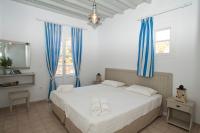 Postel nebo postele na pokoji v ubytování Gryparis' Club Apartments