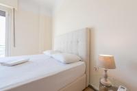 Postel nebo postele na pokoji v ubytování Super Paradise Apartments