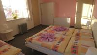 Postel nebo postele na pokoji v ubytování Hotel Šrejber