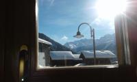 a window with a view of a snow covered mountain at Hotelski in Verbier