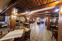a dining room with a table and some chairs at Hotel Dumanov in Bansko
