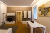 Televízia a/alebo spoločenská miestnosť v ubytovaní Vip Bergamo Rooms