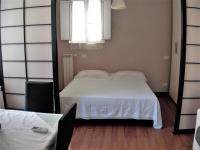 A bed or beds in a room at L'attico di Val.