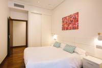 Posteľ alebo postele v izbe v ubytovaní Apartamentos San Marcial 28