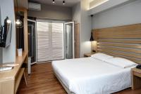 Posteľ alebo postele v izbe v ubytovaní Agamemnon Hotel