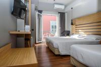 Posteľ alebo postele v izbe v ubytovaní Agamemnon Hotel