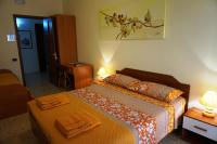 Posteľ alebo postele v izbe v ubytovaní B&B Piazza 300mila