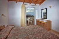 Postel nebo postele na pokoji v ubytování Ilian Beach & Apartments