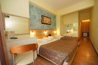 Postel nebo postele na pokoji v ubytování Socrates Hotel