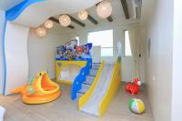 a childs room with a slide and play equipment at Chi Heng Homestay in Luodong
