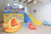 a childs room with a playroom with toys and a play set at Chi Heng Homestay in Luodong