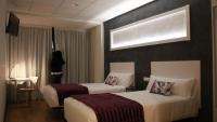 Posteľ alebo postele v izbe v ubytovaní Hotel Malecon