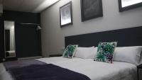 Posteľ alebo postele v izbe v ubytovaní Hotel Malecon