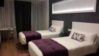 Posteľ alebo postele v izbe v ubytovaní Hotel Malecon