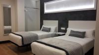 Posteľ alebo postele v izbe v ubytovaní Hotel Malecon