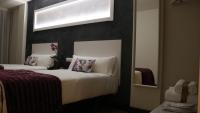 Posteľ alebo postele v izbe v ubytovaní Hotel Malecon