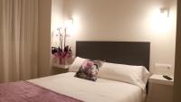 Posteľ alebo postele v izbe v ubytovaní Hotel Malecon