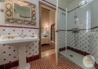 a bathroom with a sink and a shower at Hotel Argantonio in Cádiz
