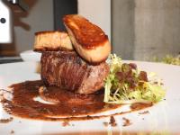 a plate of food with meat and potatoes and a salad at Café Brasserie Het Heerenhuis in Het Kalf