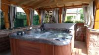 a hot tub in the middle of a patio at Chambre d&#39;Hôtes &quot;Au Vigneron&quot; in Triembach-au-Val