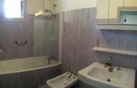 a bathroom with a sink and a tub and a toilet at Gîte du Mas Arnaud in Thuir