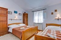 Postel nebo postele na pokoji v ubytování Maslina in Popovići (Haus für 5-7 Personen)