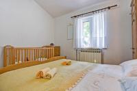 Postel nebo postele na pokoji v ubytování Maslina in Popovići (Haus für 5-7 Personen)