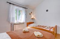 Postel nebo postele na pokoji v ubytování Maslina in Popovići (Haus für 5-7 Personen)