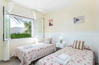 Postel nebo postele na pokoji v ubytování Villa Marismas Sombra