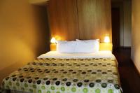 Uma cama ou camas num quarto em Hotel Da Montanha