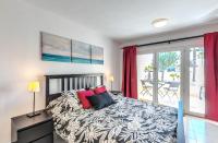 A bed or beds in a room at Casa Atlantis Playa Roca