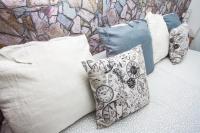 a group of pillows sitting on a bed at Hostal Caminito del Rey in Alora