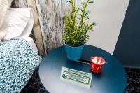 a blue table with a potted plant on top of it at Hostal Caminito del Rey in Alora