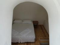 A bed or beds in a room at Thera Incognita Studios