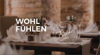 a table with a sign that reads wolf fulfilled at Boutique - Hotel Zum Schloss in Amtzell