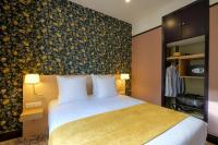 Hôtel de France, un hôtel AMMIにあるベッド