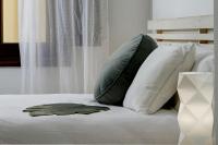 A bed or beds in a room at Home4u, Elvira 16, 2A