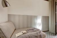 A bed or beds in a room at Home4u, Elvira 16, 2A