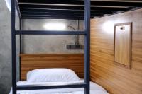 Postel nebo postele na pokoji v ubytování Baan Lung Poshtel