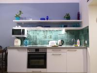 A kitchen or kitchenette at Tempo Life Apartman
