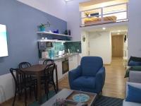 A kitchen or kitchenette at Tempo Life Apartman