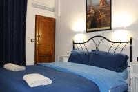 A bed or beds in a room at Gmax Guelfa Apartments