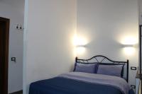 A bed or beds in a room at Gmax Guelfa Apartments