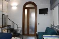 A television and/or entertainment centre at Gmax Guelfa Apartments