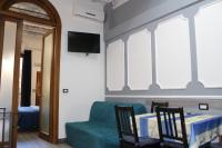 A television and/or entertainment centre at Gmax Guelfa Apartments